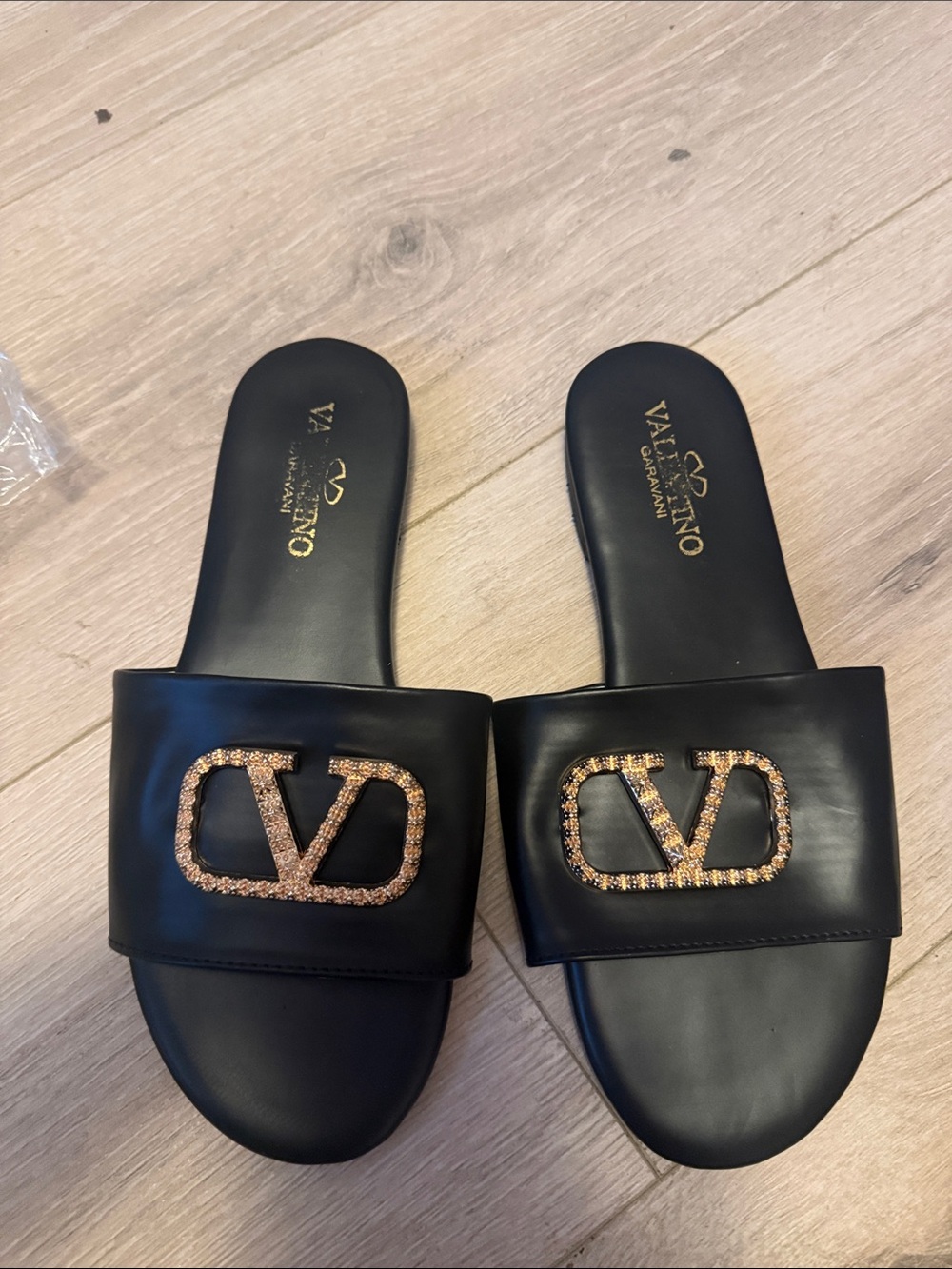 Valentino Garavani Black Slides with Gold Crystal VLogo